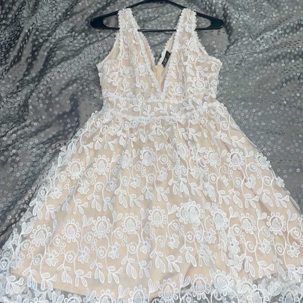 Small white flower and beige dress… perfect for a special occasion